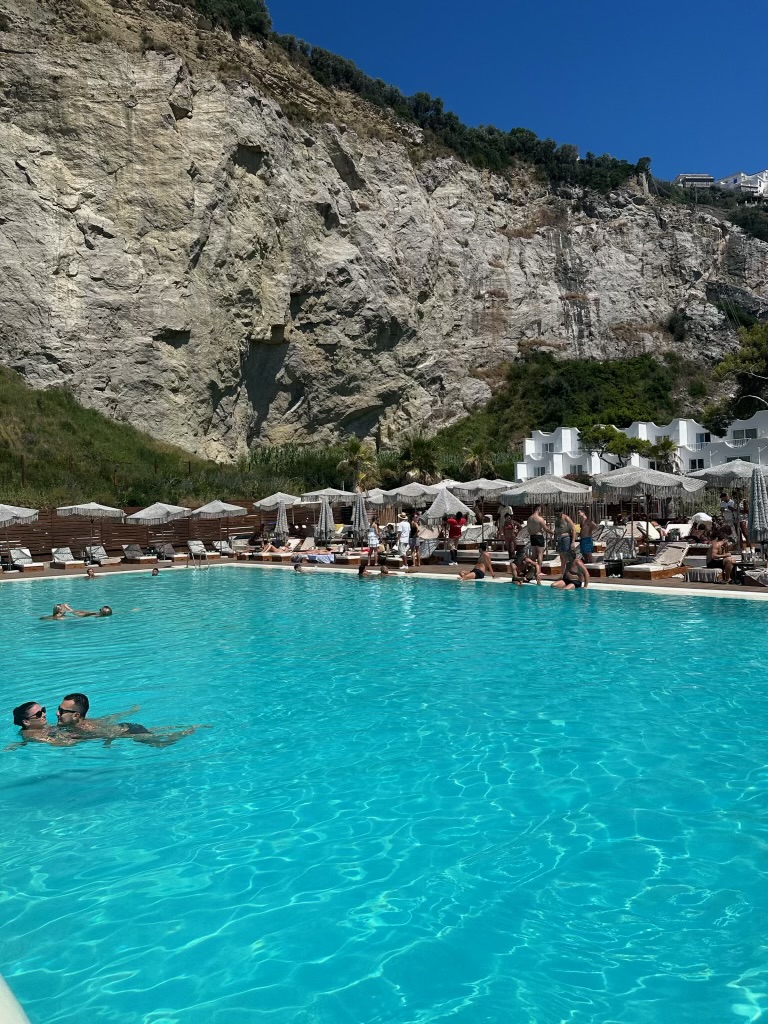 Infinity pool on a cliffside terrace overlooking the Amalfi Coast in Italy