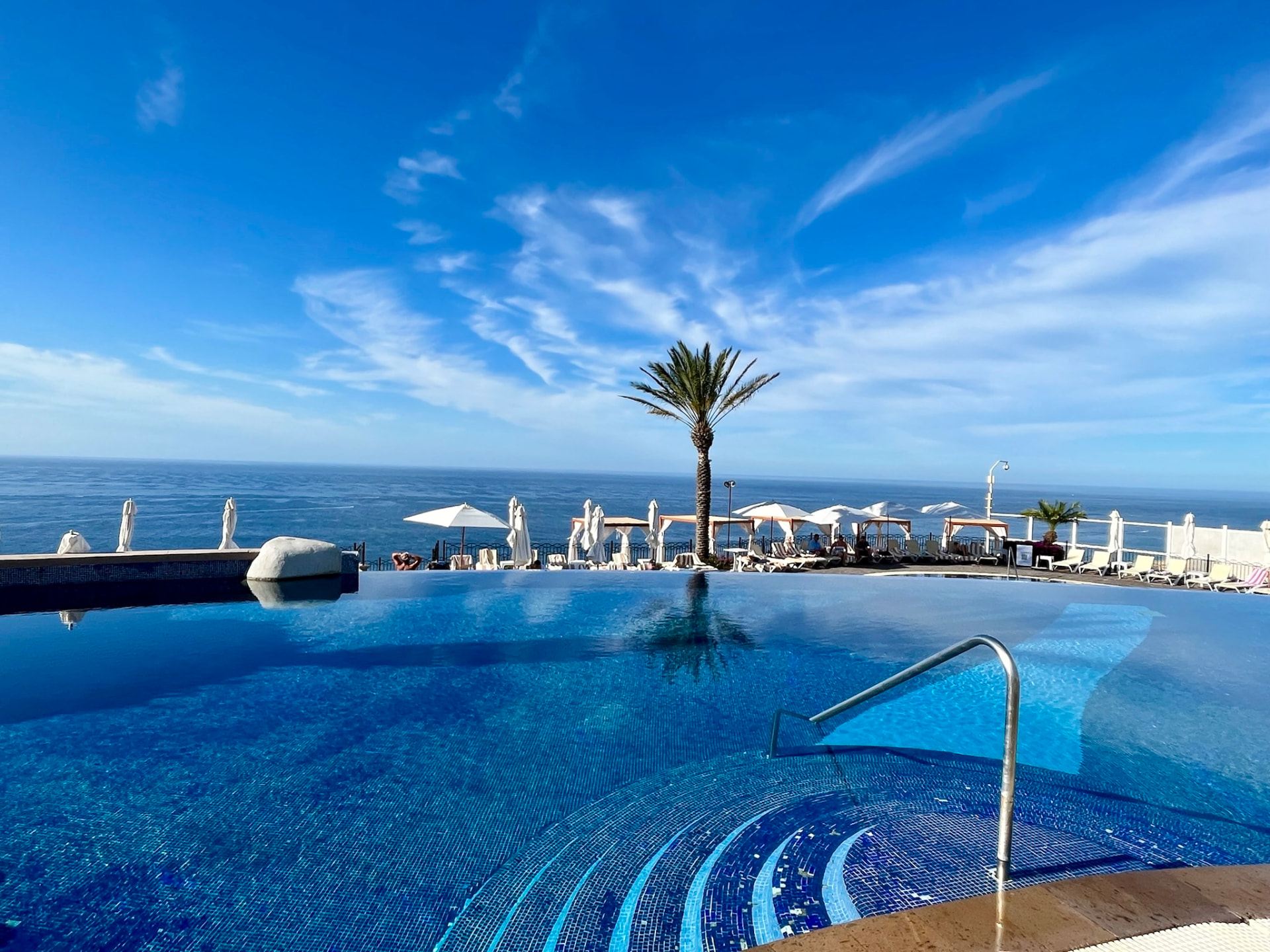 Infinity pool overlooking the Mediterranean at sunset — bespoke European travel, beautifully planned