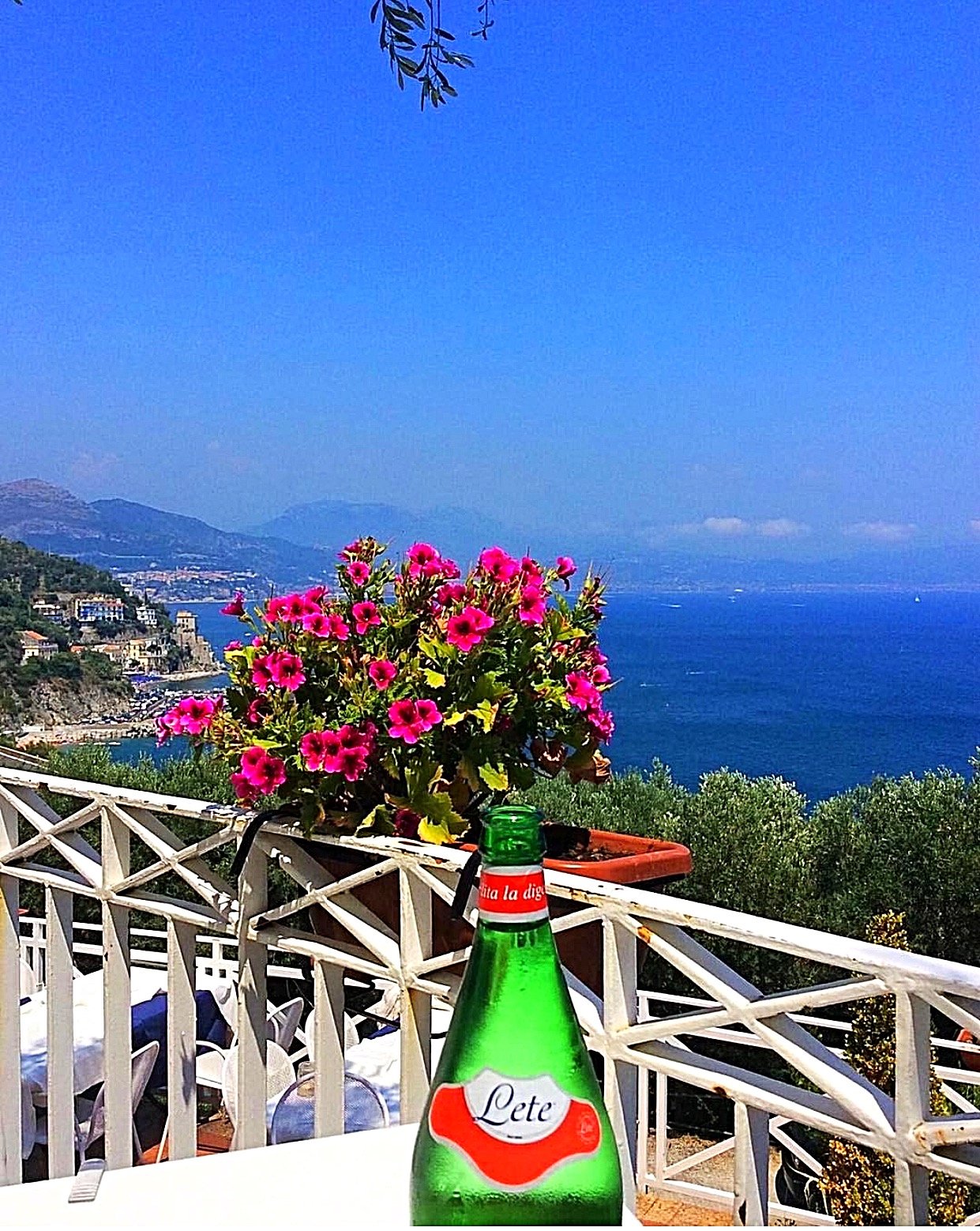 A table set for two on a garden terrace above the sea in Ravello on the Amalfi Coast, Italy