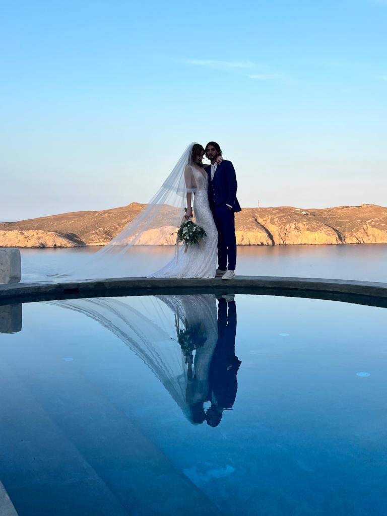 Elegant infinity pool terrace at a Greek island wedding venue overlooking the Aegean sea