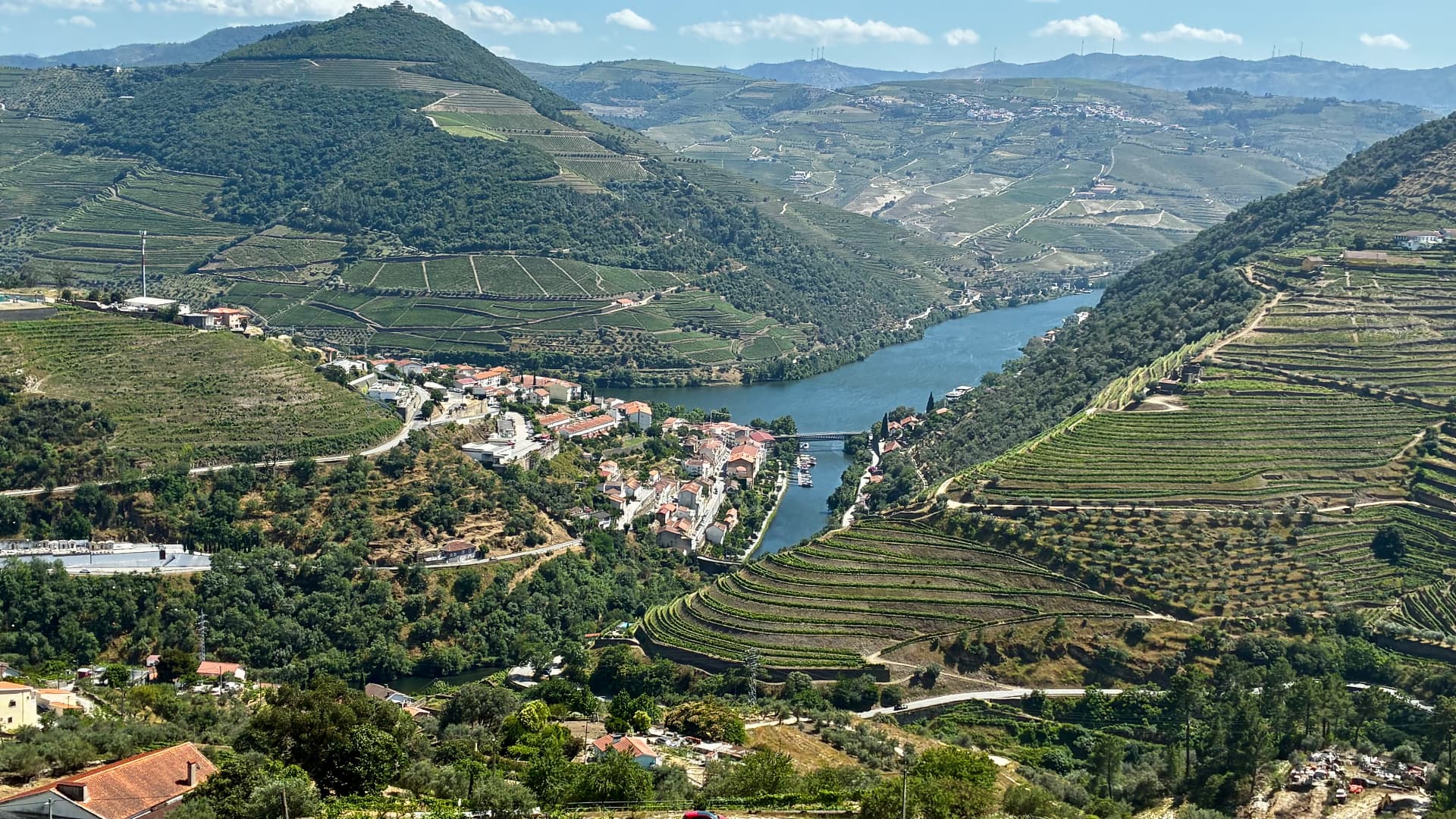 The Douro river winding between terraced port wine vineyards in northern Portugal